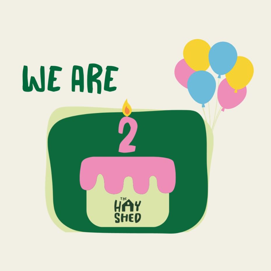 The Hay Shed is 2 - A birthday cake with 2 candle and some balloons